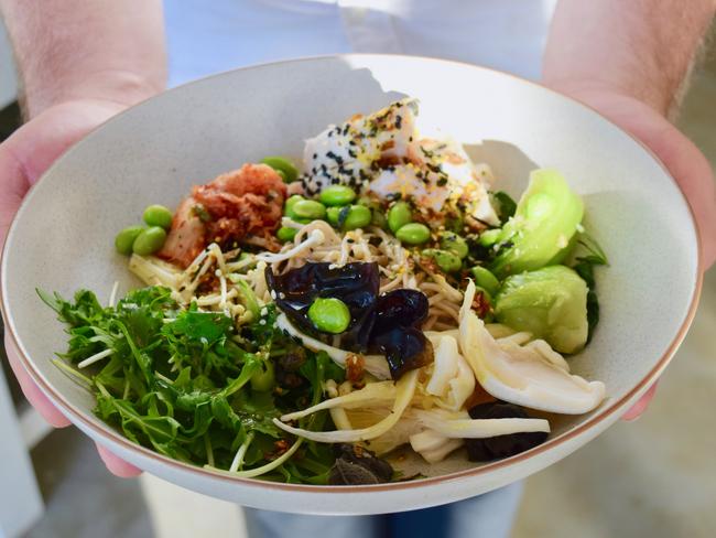 The Collaroy’s chicken bowl with poached chicken breast, raw bok choy, soba noodles, shitake, fermented cabbage, edamame and ginger-turmeric dressing. Picture: Jenifer Jagielski