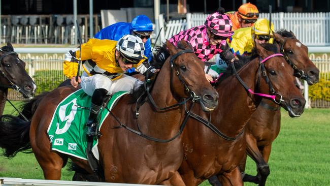 Tambo's Mate (left) wins the BRC Sprint at Doomben. Picture: AAP