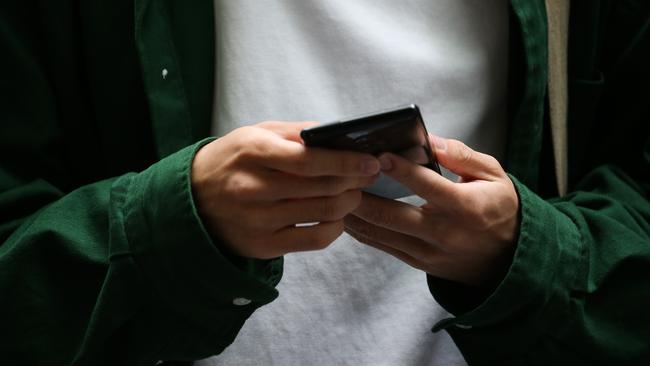 SYDNEY, AUSTRALIA - Newswire Photos DECEMBER 18, 2022: Members of the public are seen using their phone as the personal data of Australians is being stolen at a rate of more than 20 times above the global average new research reveals. Picture: NCA Newswire / Gaye Gerard