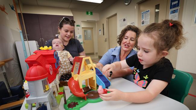 Latrobe Regional Health Hospital Paediatrics Rehabilitation Coordinator Monique MacDougall with Mum Tonya Ryan of Moe with her baby Archer born 27 weeks premature and Audrey Butterfield 6 in the rehabilitation playroom at the hospital. Picture: David Caird