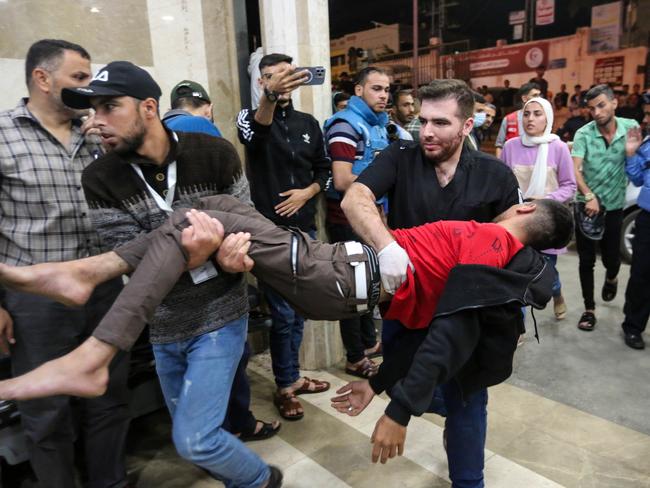 Palestinians injured in Israeli air raids arrive at Nasser Medical Hospital in Khan Yunis, Gaza. Picture: Getty Images