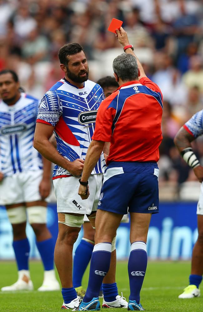 Kane Thompson of Samoa is shown a red card by referee John Lacey.