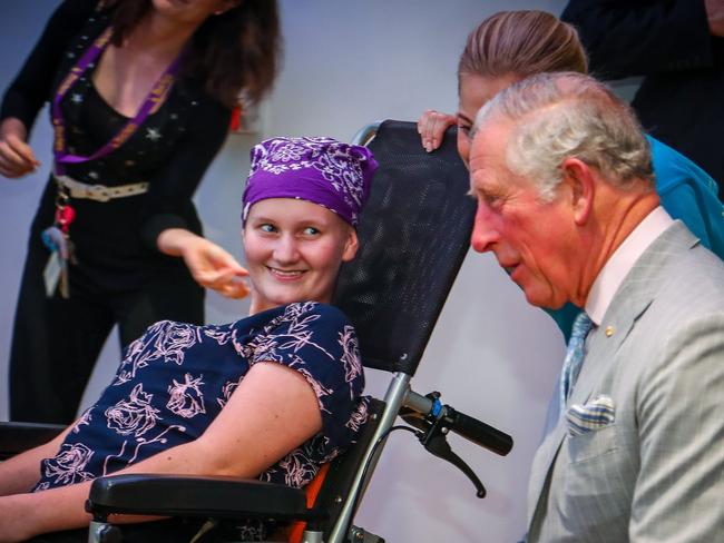 Britain’s Prince Charles sits with Abbi Head, 13, during his official visit to the Lady Cilento Children’s Hospital in Brisbane. Picture: Patrick Hamilton/AFP