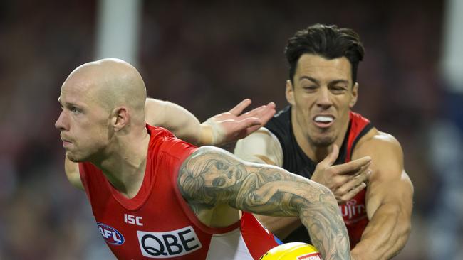 Sydney’s Zak Jones breaks a tackle from Dylan Shiel. Picture: AAP