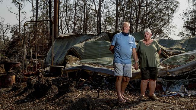 The Skeens outside their destroyed old home last year. Picture: Jerad Williams