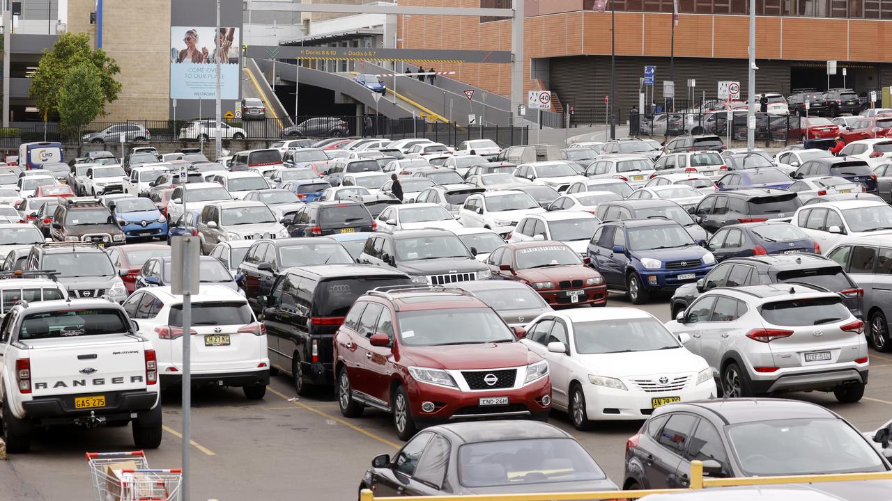 A busy car park as people shop at Kmart in Blacktown. Picture: Jonathan Ng