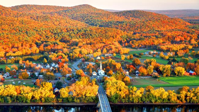 Connecticut River winding through the Poineer valley region of Massachusetts. Photo taken from a scenic viewpoint on Sugurloaf Mountain in Sunderland  at dusk. The Pioneer Valley is known for its scenery and as a vacation destination and its beautiful fall foliage ranks with the best in New England