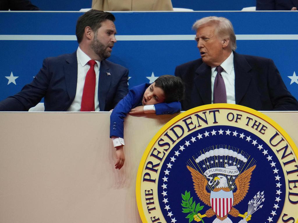 US Vice President JD Vance, his son Ewan, 7, and U.S. President Donald Trump Trump during inauguration parade at Capital One Arena.