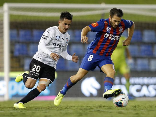 Wes Hoolahan of the Jets turns the ball from Adrian Luna  of Melbourne City during the Round 26 A-League match between the Newcastle Jets and the Melbourne City at McDonald Jones Stadium in Newcastle, Monday, March 23, 2020. (AAP Image/Darren Pateman) NO ARCHIVING, EDITORIAL USE ONLY