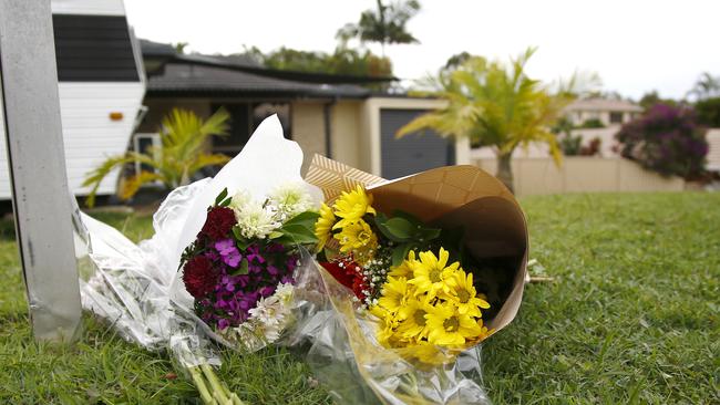 Floral tributes outside the home where Kelly Wilkinson was set on fire. Picture: Tertius Pickard