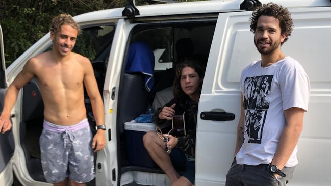 Brazilian travellers Bruno Trad, 26, Bruno Di Piero, 26, and Flavio Pineda, 23, at Tallow Beach in August.