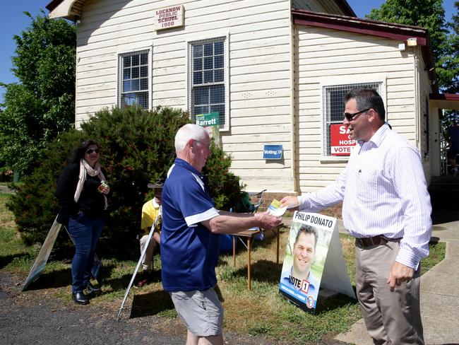 Orange, Shooters Fishers and Farmers Party candidate Philip Donato meets voters at the Lucknow Community Hall polling booth for the Orange by-election. Picture: Jonathan Ng