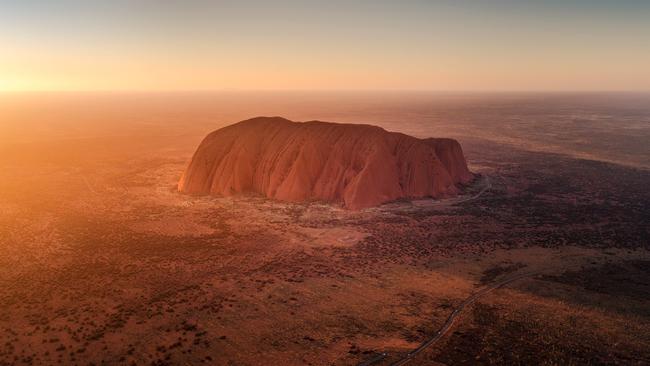 Uluru, a massive sandstone monolith in the heart of the NT’s arid Red Centre, is thought to have started forming around 550 million years ago. Picture: Luke Tscharke / Tourism NT