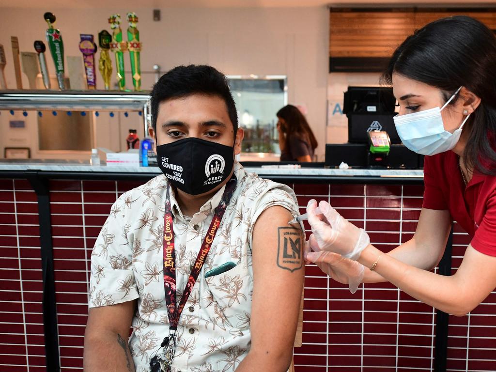 The Australian federal government is working on a vaccine passport system. Photo by Frederic J. BROWN/AFP