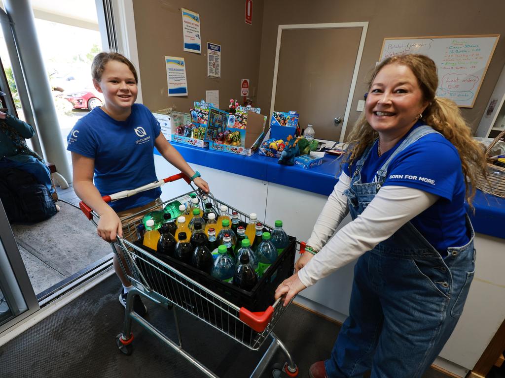 Sebastian and Kelly Williamson from GlobalCare cart in a trolley full of beverages. Picture: Scott Calvin