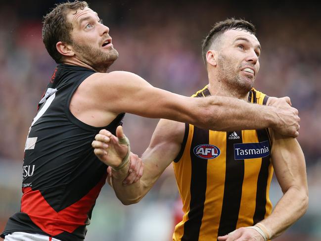 AFL Round 20. 04/08/2018. Hawthorn v Essendon at the MCG. Essendon's Tom Bellchambers and Hawthorn's Jonathon Ceglar   .Pic: Michael Klein