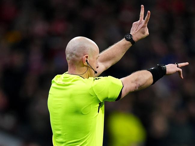 Referee Szymon Marciniak gestures as the penalty kick for Atletico de Madrid’s Julian Alvarez is ruled out. Picture: Getty Images