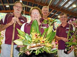 SMELL THE FLOWERS: Hervey Bay Orchid Society's Rob Anderson, Carol Jenkins, Giles Blaber and Keith Lyiadat at the Hervey Bay Spring Orchid and Garden Spectacular on Friday. Picture: Cody Fox