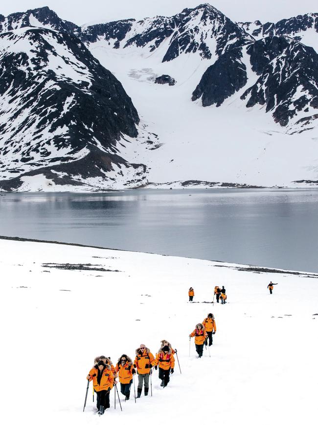 Heading ashore for a hike, the passengers kitted out in Ponant’s luxurious polar jackets. Picture: Elise Hassey