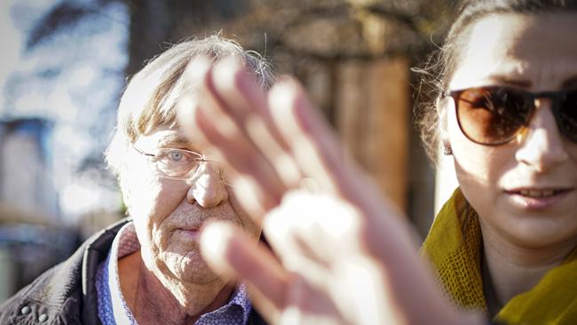 Brian John Turner, left, leaves the Adelaide Magistrates Court with a supporter, right. Picture: Mike Burton.