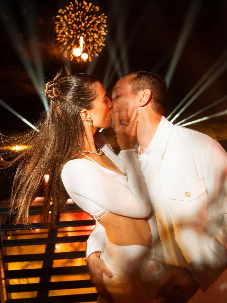 Camille Fishel and Michael Rubin share a kiss.