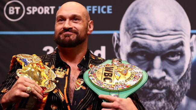 (FILES) In this file photo taken on April 20, 2022 World Boxing Council (WBC) heavyweight title holder Britain's Tyson Fury takes part in an pre-fight press conference at Wembley Stadium in west London. - WBC heavyweight champion Tyson Fury said he is retiring from boxing on his 34th birthday on August 12, 2022, having previously performed a number of U-turns over his future in the sport. "After long hard conversations I've finally decided to walk away & on my 34th birthday I say Bon voyage," Fury posted on Twitter. (Photo by Adrian DENNIS / AFP)