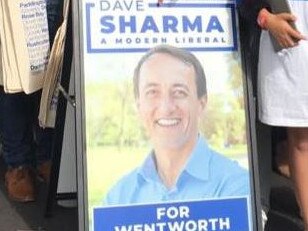 Dave Sharma's new election material has a big change compared to last year's signs.