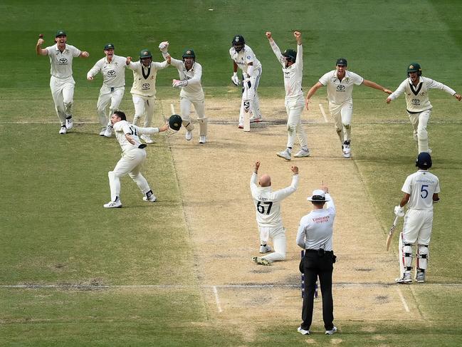 MELBOURNE, AUSTRALIA - DECEMBER 30: Nathan Lyon of Australia is congratulated by team mates after trapping Mohammed Siraj lbw for Australia to win the match during day five of the Men's Fourth Test Match in the series between Australia and India at Melbourne Cricket Ground on December 30, 2024 in Melbourne, Australia. (Photo by Quinn Rooney/Getty Images)