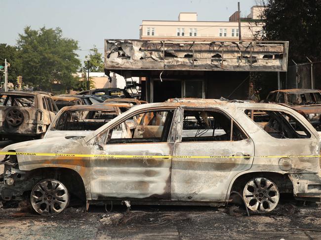 Burned out vehicles sit at a used car yard after a night of unrest, after police shot Jacob Blake multiple times in the back. Picture: Getty Images/AFP