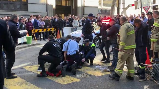 The man being apprehended by police near Clarence St in Sydney. Picture: Marc Kean