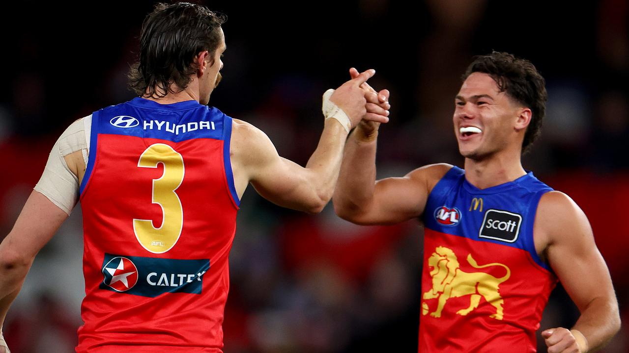 MELBOURNE, AUSTRALIA - AUGUST 04: Cam Rayner of the Lions is congratulated by Joe Daniher after kicking a goal during the round 21 AFL match between St Kilda Saints and Brisbane Lions at Marvel Stadium, on August 04, 2024, in Melbourne, Australia. (Photo by Josh Chadwick/AFL Photos/via Getty Images)