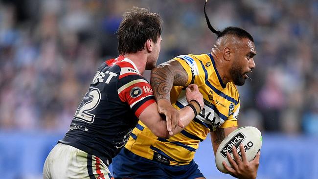 Junior Paulo of the Eels is tackled by Angus Crichton of the Roosters during the Round 6 NRL match between the Sydney Roosters and the Parramatta Eels at Bankwest Stadium in Sydney, Saturday, June 20, 2020. (AAP Image/Dan Himbrechts) NO ARCHIVING, EDITORIAL USE ONLY