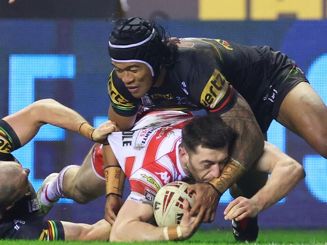 WIGAN, ENGLAND - FEBRUARY 24: Jake Wardle of Wigan Warriors goes down before going over to score his team's third try during the Betfred World Club Challenge match between Wigan Warriors and Penrith Panthers at DW Stadium on February 24, 2024 in Wigan, England. (Photo by Lewis Storey/Getty Images)