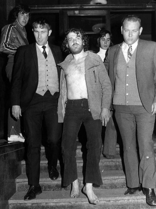 1972: English singer Joe Cocker is led away by police at Melbourne’s Russell St police HQ after being arrested after a fracas at his hotel during his first Australian tour. The singer had earlier been arrested for possession in Adelaide and was deported after the Melbourne incident. File picture