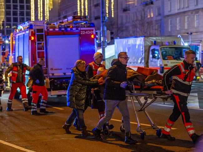 Ambulance crews ferry equipment on stretchers away annual Christmas market in the city centre following an attack on December 20, 2024 in Magdeburg, Germany. Picture: Craig Stennett/Getty Images