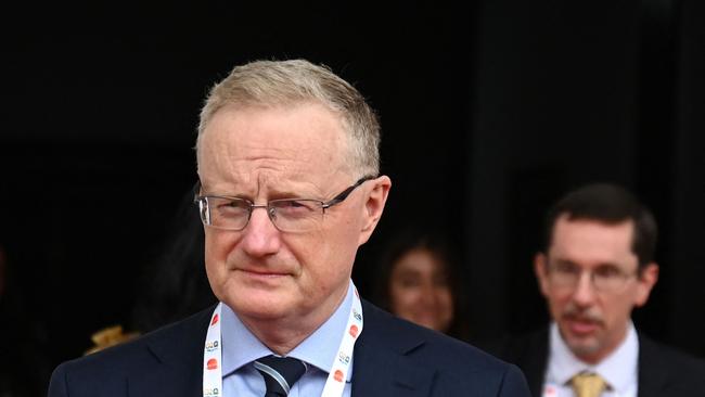 The Reserve Bank of Australia governor Philip Lowe comes out during a break at the G20 Finance Ministers, Central Bank Governors (FMCBG) and Finance & Central Bank Deputies (FCBD) meetings, at the Mahatma Mandir in Gandhinagar on July 17, 2023. G20 finance ministers and central bank chiefs opened talks on July 17 discussing debt restructuring deals, multilateral bank reform and finance to tackle climate change, aiming to bolster a sagging global economy. (Photo by Punit PARANJPE / AFP)