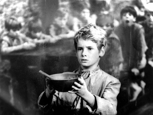 The famous scene from Oliver Twist, where he asks for more food. Still from 1968 movie Oliver, with actor Mark Lester. Pic UPI.