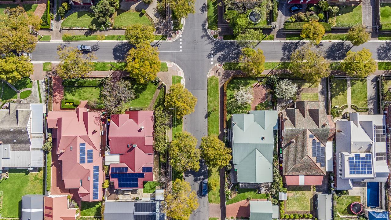 Aerial view of leafy eastern suburban houses on 4-way cross road intersection in Adelaide, South Australia, housing overhead real estate generic