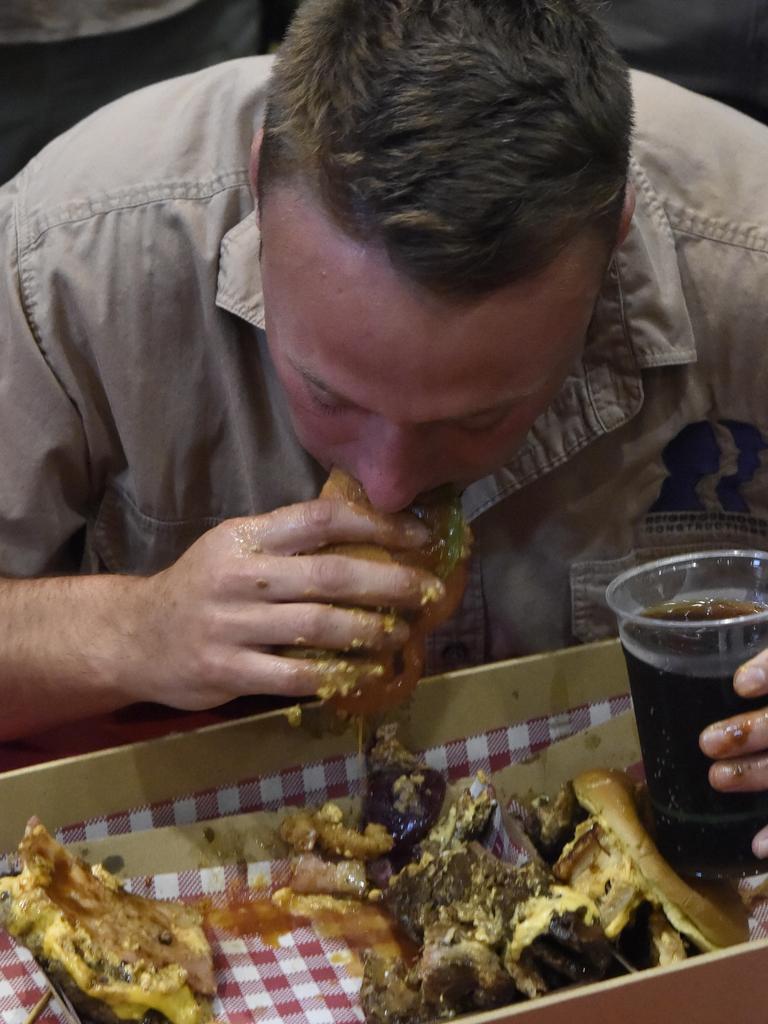 And we’re off ... Isaac Harding-Davis devours District North Kitchen's 1.5kg burger. Pictures: Amanda Parkinson