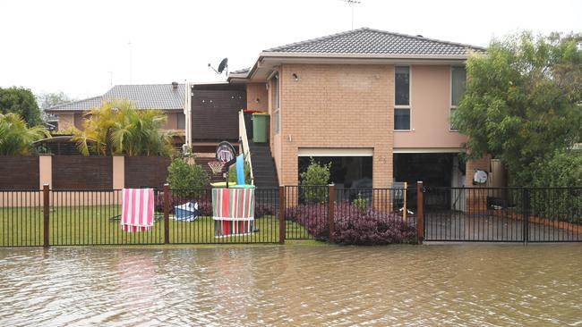 Homes in Smallwood Rd in McGraths Hill were inundated with flood water. Picture: John Grainger