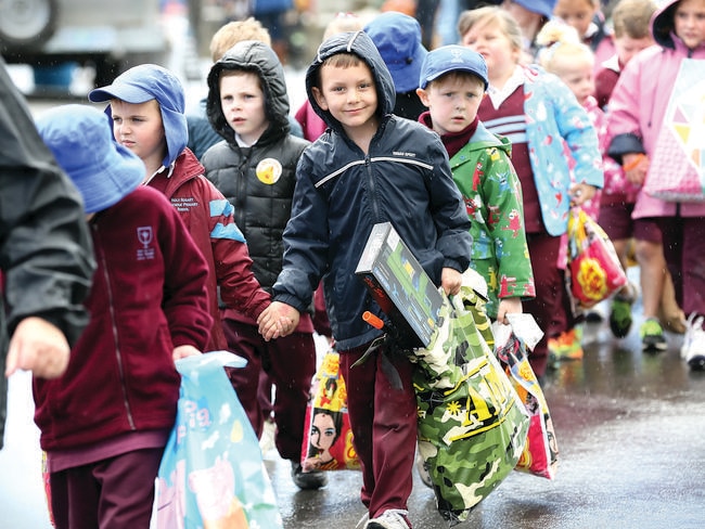 Students from Holy Rosary Catholic School on their way home with their goodies.