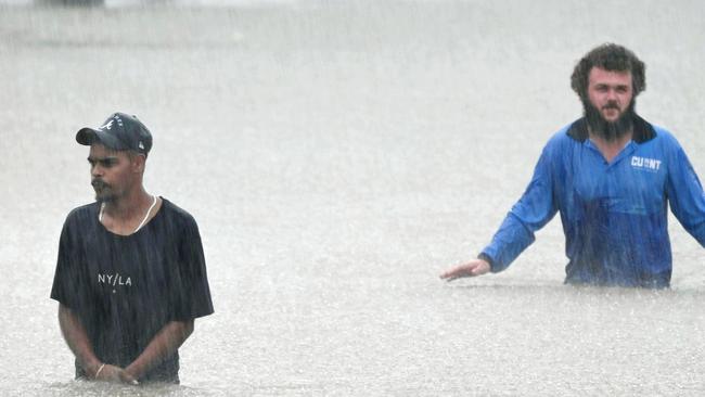 Flooding in the streets of Ingham. Photo: Mostyn Swain