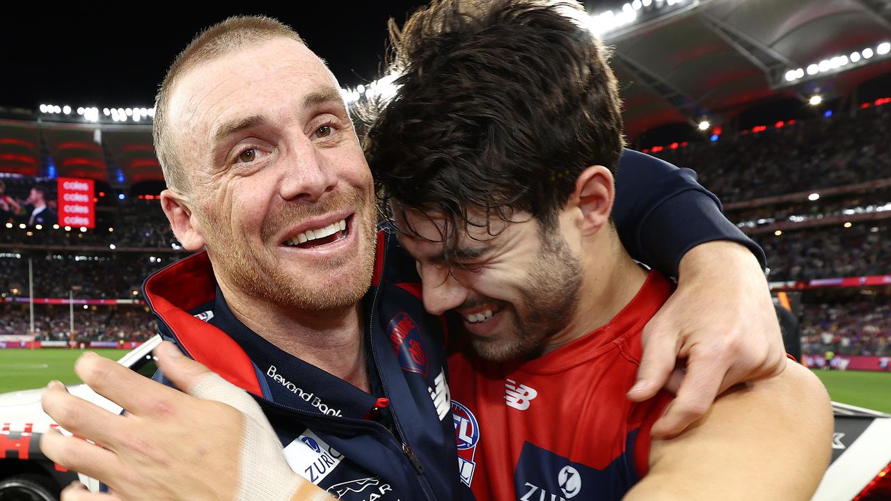 Simon Goodwin embraces Norm Smith medallist Christian Petracca. Picture: Michael Klein