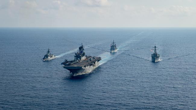 The Royal Australian Navy helicopter frigate HMAS Parramatta conducts officer of the watch manoeuvres with amphibious assault ship USS America, guided-missile cruiser USS Bunker Hill and guided-missile destroyer USS Barry in the South China Sea. Picture: Department of Defence