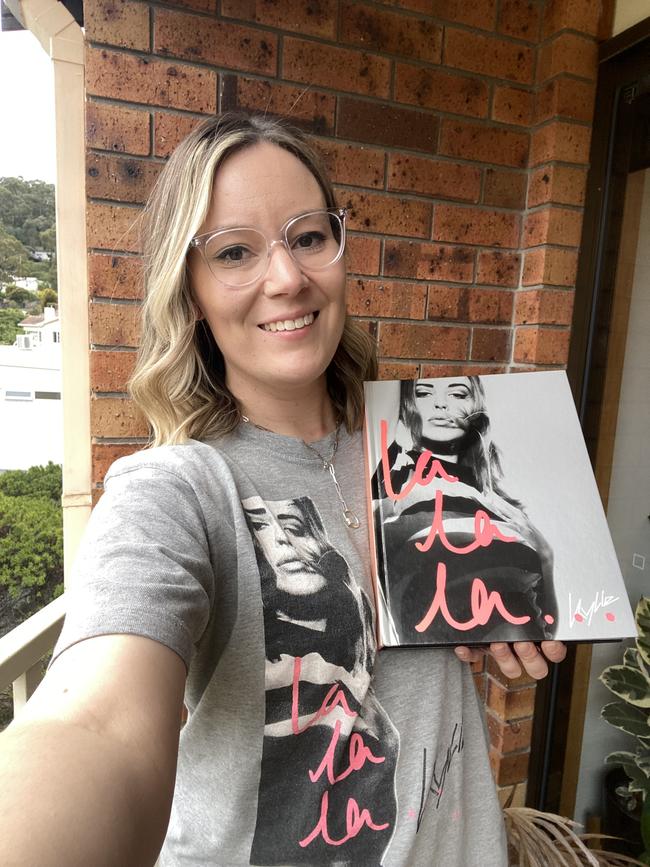 Britt Aylen with a Kylie shirt and a Kylie book