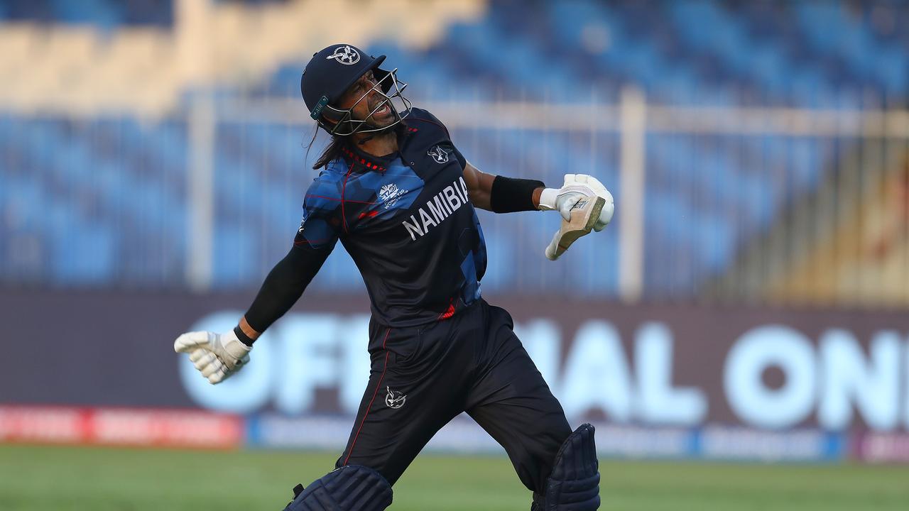 SHARJAH, UNITED ARAB EMIRATES - OCTOBER 22: David Wiese of Namibia celebrates hitting the winning runs during the ICC Men's T20 World Cup match between Namibia and Ireland at Sharjah Cricket Stadium on October 22, 2021 in Sharjah, United Arab Emirates. (Photo by Matthew Lewis-ICC/ICC via Getty Images)