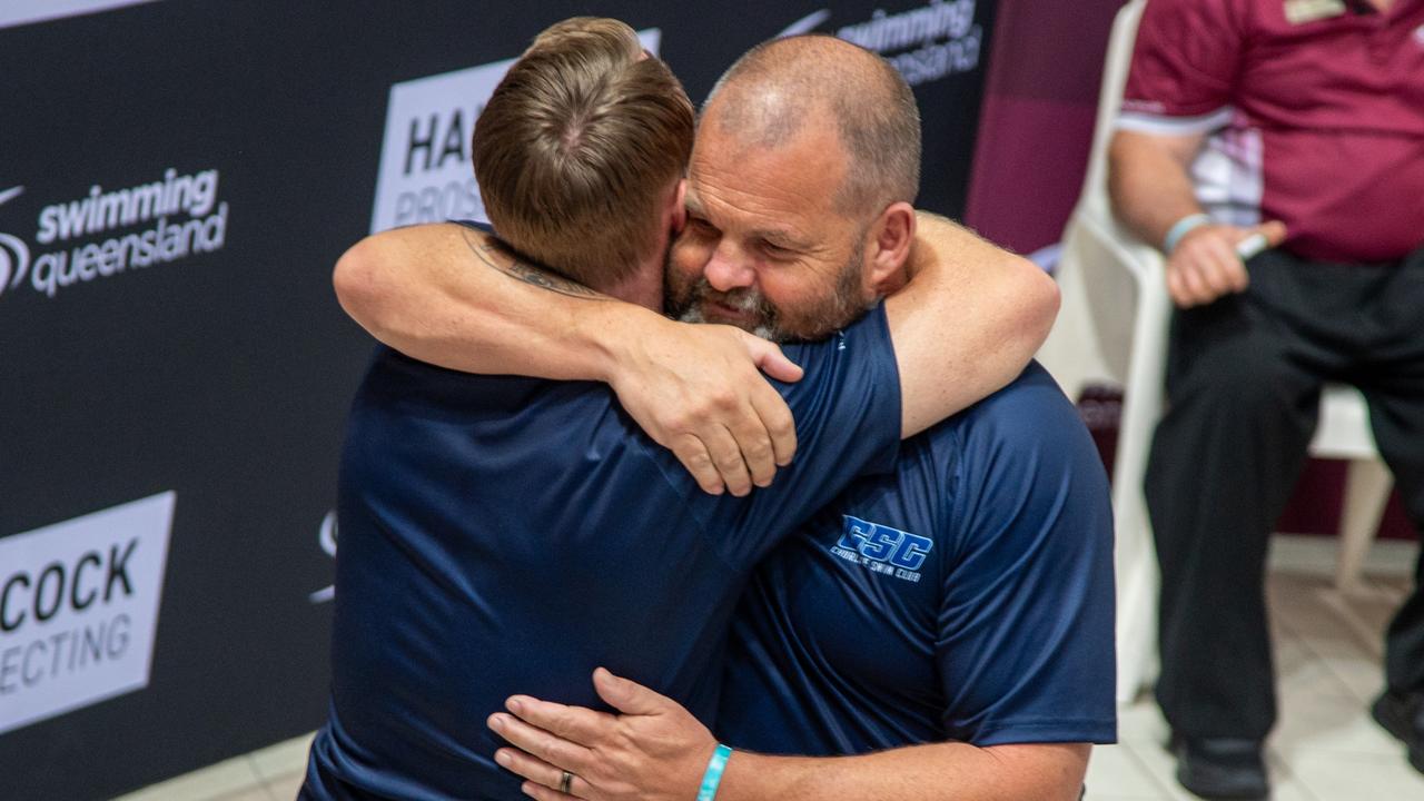 Richard Sleight and Liam Smith hug on the final night of the 2024 state swimming championships, December 20, on the Gold Coast. Picture Supplied