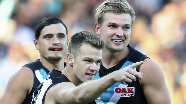 Three of the best ... Robbie Gray celebrates yet another goal with in-form teammates Sam Powell-Pepper and Ollie Wines. Picture: Sarah Reed