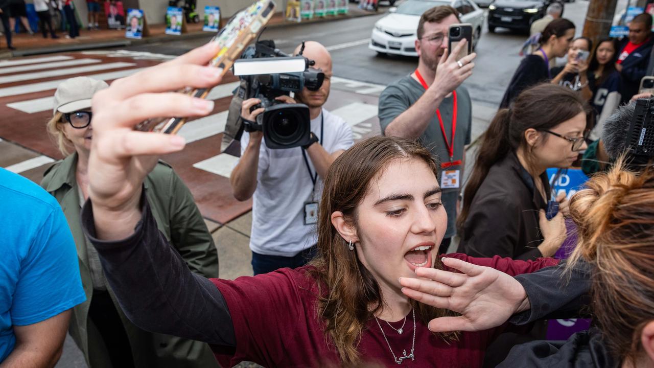 Fatima Payman senate candidate Emanie Darwiche (centre) heckled the Prime Minister on Gaza while he walked past in Banks. Picture: Jason Edwards / NewsWir