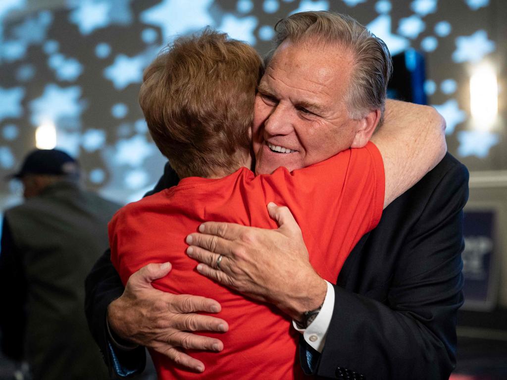 Republican US Senate candidate Mike Rogers gets a hug from his aunt, Barbara Hess, at his election watch party in Novi, Michigan. Picture: Getty Images.